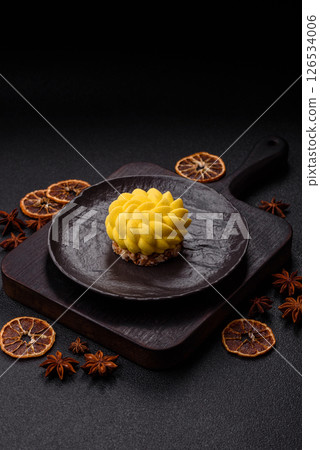 Round sweet tart of yellow color with citrus and passion fruit flavor Round sweet tart of yellow color with citrus and passion fruit flavor 126534006