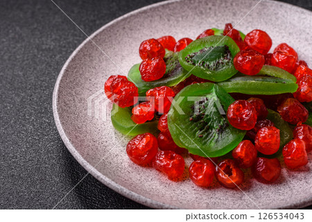 Dried sweet red pitted cherries or candied fruits 126534043