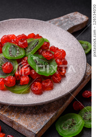 Dried sweet red pitted cherries or candied fruits 126534050