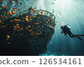 Scuba diver navigates the underwater world, exploring a decaying shipwreck teeming with colorful fish and vibrant coral, showcasing the beauty and mystery of the deep sea 126534161