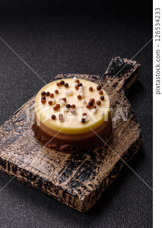 Sweet round tart three chocolates 126534233