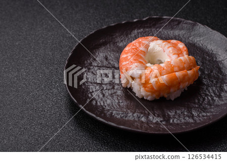 Donut shaped sushi rolls with salmon, shrimp and tuna Donut shaped sushi rolls with salmon, shrimp and tuna 126534415