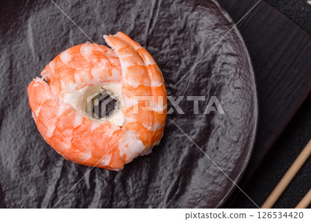 Donut shaped sushi rolls with salmon, shrimp and tuna Donut shaped sushi rolls with salmon, shrimp and tuna 126534420