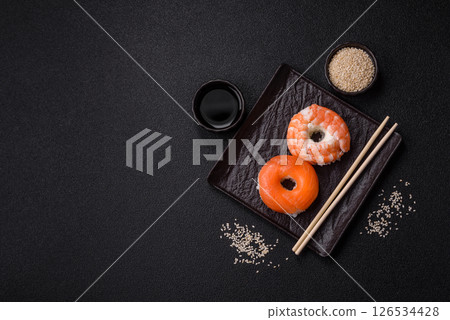 Donut shaped sushi rolls with salmon, shrimp and tuna Donut shaped sushi rolls with salmon, shrimp and tuna 126534428