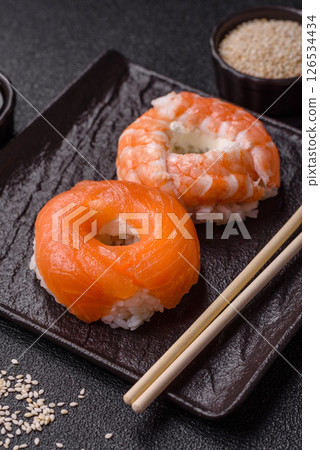 Donut shaped sushi rolls with salmon, shrimp and tuna Donut shaped sushi rolls with salmon, shrimp and tuna 126534434