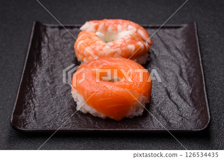 Donut shaped sushi rolls with salmon, shrimp and tuna Donut shaped sushi rolls with salmon, shrimp and tuna 126534435