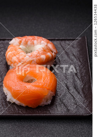 Donut shaped sushi rolls with salmon, shrimp and tuna Donut shaped sushi rolls with salmon, shrimp and tuna 126534438
