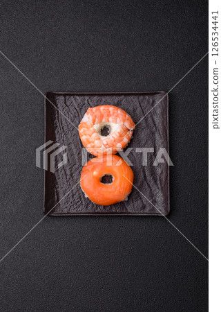 Donut shaped sushi rolls with salmon, shrimp and tuna Donut shaped sushi rolls with salmon, shrimp and tuna 126534441