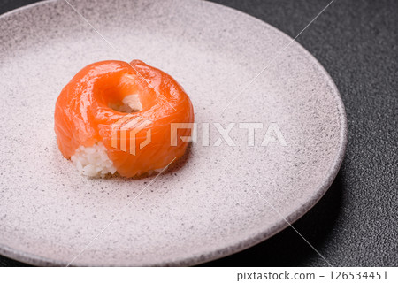 Donut shaped sushi rolls with salmon, shrimp and tuna Donut shaped sushi rolls with salmon, shrimp and tuna 126534451