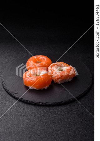 Donut shaped sushi rolls with salmon, shrimp and tuna 126534461