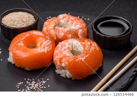 Donut shaped sushi rolls with salmon, shrimp and tuna Donut shaped sushi rolls with salmon, shrimp and tuna 126534466