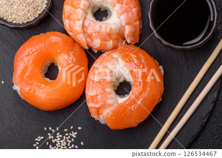 Donut shaped sushi rolls with salmon, shrimp and tuna Donut shaped sushi rolls with salmon, shrimp and tuna 126534467