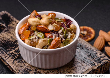 Honeyed cashew nuts, walnuts, hazelnuts, pine nuts and dried fruits 126534519