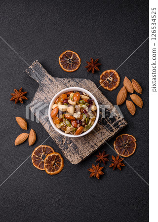 Honeyed cashew nuts, walnuts, hazelnuts, pine nuts and dried fruits 126534525