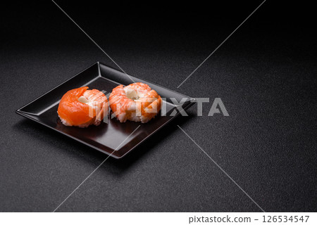 Donut shaped sushi rolls with salmon, shrimp and tuna Donut shaped sushi rolls with salmon, shrimp and tuna 126534547