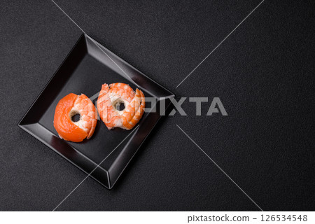 Donut shaped sushi rolls with salmon, shrimp and tuna Donut shaped sushi rolls with salmon, shrimp and tuna 126534548