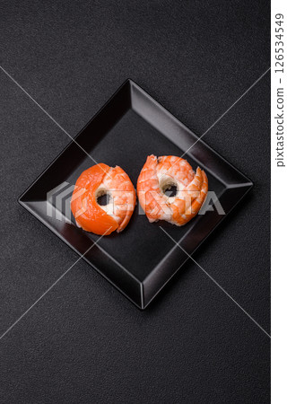 Donut shaped sushi rolls with salmon, shrimp and tuna Donut shaped sushi rolls with salmon, shrimp and tuna 126534549
