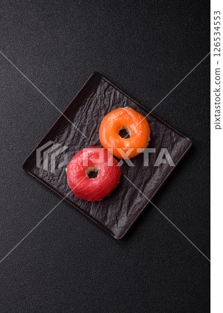 Donut shaped sushi rolls with salmon, shrimp and tuna Donut shaped sushi rolls with salmon, shrimp and tuna 126534553
