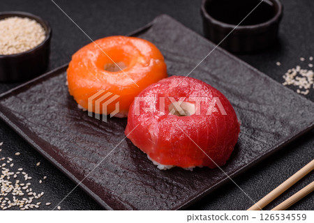 Donut shaped sushi rolls with salmon, shrimp and tuna 126534559