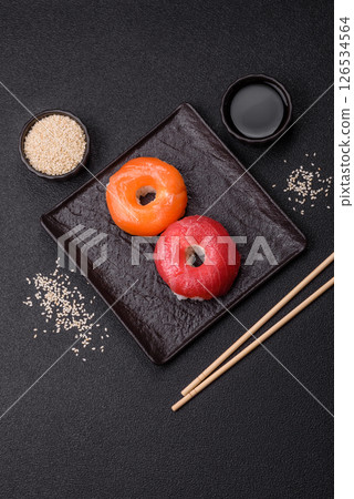 Donut shaped sushi rolls with salmon, shrimp and tuna Donut shaped sushi rolls with salmon, shrimp and tuna 126534564