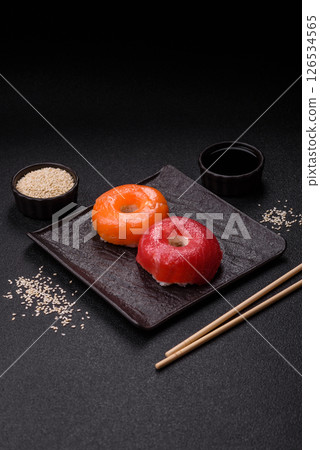 Donut shaped sushi rolls with salmon, shrimp and tuna Donut shaped sushi rolls with salmon, shrimp and tuna 126534565