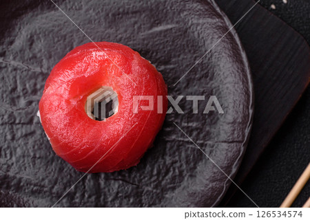 Donut shaped sushi rolls with salmon, shrimp and tuna Donut shaped sushi rolls with salmon, shrimp and tuna 126534574