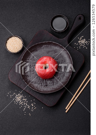 Donut shaped sushi rolls with salmon, shrimp and tuna 126534579