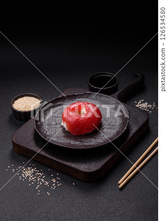 Donut shaped sushi rolls with salmon, shrimp and tuna 126534580