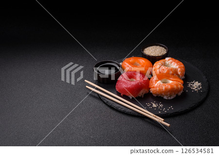 Donut shaped sushi rolls with salmon, shrimp and tuna Donut shaped sushi rolls with salmon, shrimp and tuna 126534581