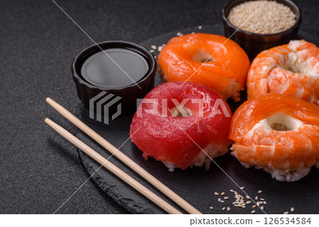 Donut shaped sushi rolls with salmon, shrimp and tuna Donut shaped sushi rolls with salmon, shrimp and tuna 126534584