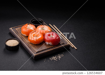 Donut shaped sushi rolls with salmon, shrimp and tuna 126534607