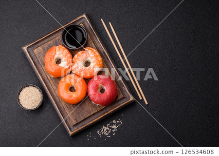 Donut shaped sushi rolls with salmon, shrimp and tuna 126534608