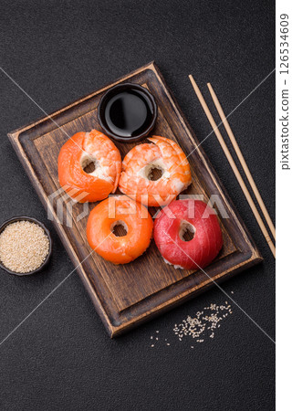Donut shaped sushi rolls with salmon, shrimp and tuna 126534609
