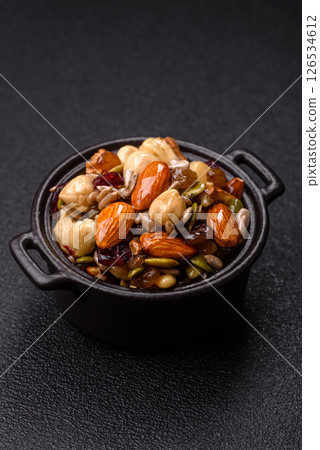 Honeyed cashew nuts, walnuts, hazelnuts, pine nuts and dried fruits Honeyed cashew nuts, walnuts, hazelnuts, pine nuts and dried fruits 126534612
