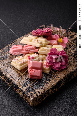 Multicolored handmade chocolate bars pink, white, brown colors 126534622