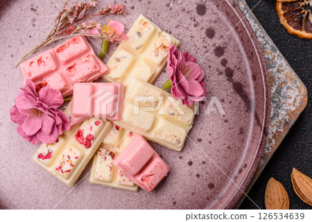 Multicolored handmade chocolate bars pink, white, brown colors 126534639