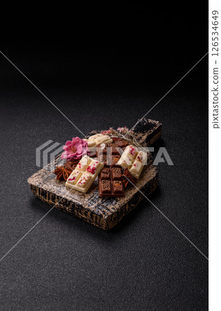 Multicolored handmade chocolate bars pink, white, brown colors Multicolored handmade chocolate bars pink, white, brown colors 126534649