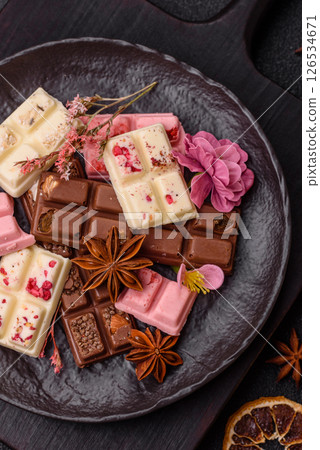 Multicolored handmade chocolate bars pink, white, brown colors 126534671