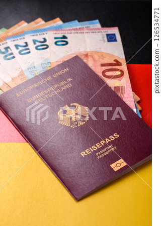 German citizen passport against the background of the German national flag German citizen passport against the background of the German national flag 126534771