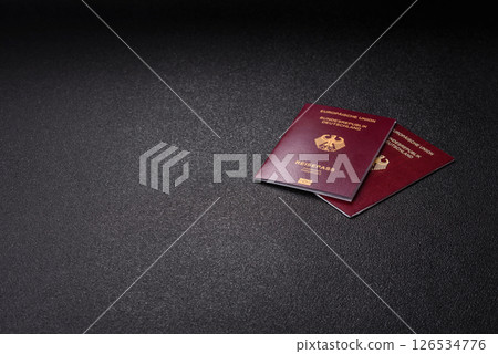 German citizen passport against the black textured background German citizen passport against the black textured background 126534776