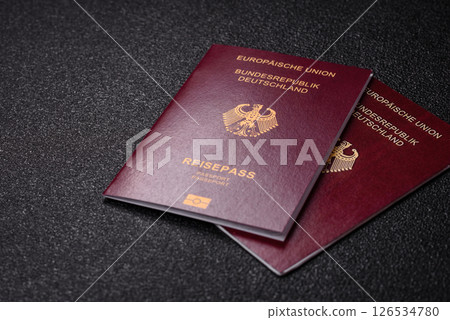 German citizen passport against the black textured background German citizen passport against the black textured background 126534780