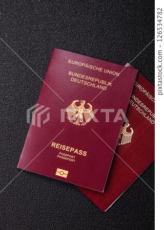 German citizen passport against the black textured background 126534782