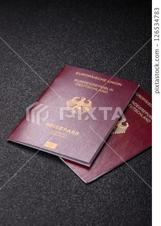 German citizen passport against the black textured background German citizen passport against the black textured background 126534783