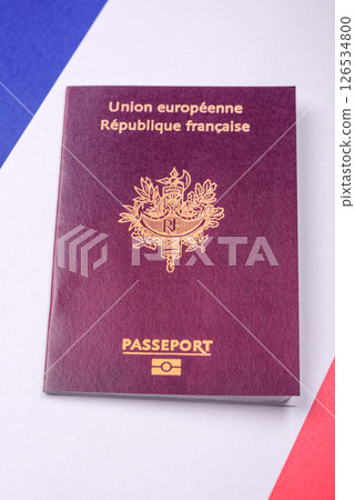 France citizen passport against the background of the France national flag France citizen passport against the background of the France national flag 126534800