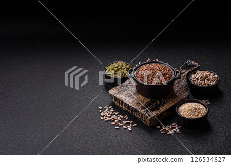 Flax seeds in a bowl, an ingredient for making vegan or vegetarian food Flax seeds in a bowl, an ingredient for making vegan or vegetarian food 126534827