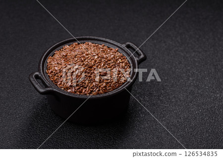 Flax seeds in a bowl, an ingredient for making vegan or vegetarian food Flax seeds in a bowl, an ingredient for making vegan or vegetarian food 126534835