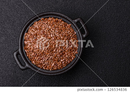 Flax seeds in a bowl, an ingredient for making vegan or vegetarian food Flax seeds in a bowl, an ingredient for making vegan or vegetarian food 126534836