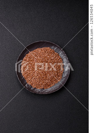 Flax seeds in a bowl, an ingredient for making vegan or vegetarian food 126534845