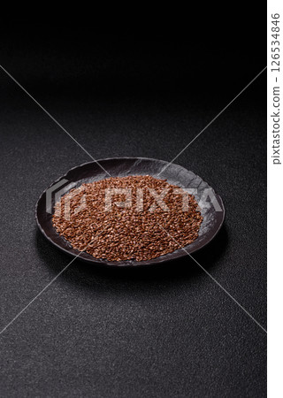Flax seeds in a bowl, an ingredient for making vegan or vegetarian food 126534846