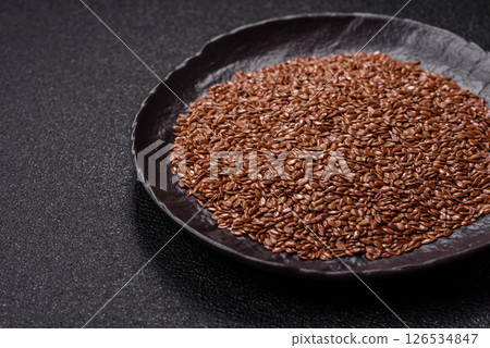 Flax seeds in a bowl, an ingredient for making vegan or vegetarian food 126534847